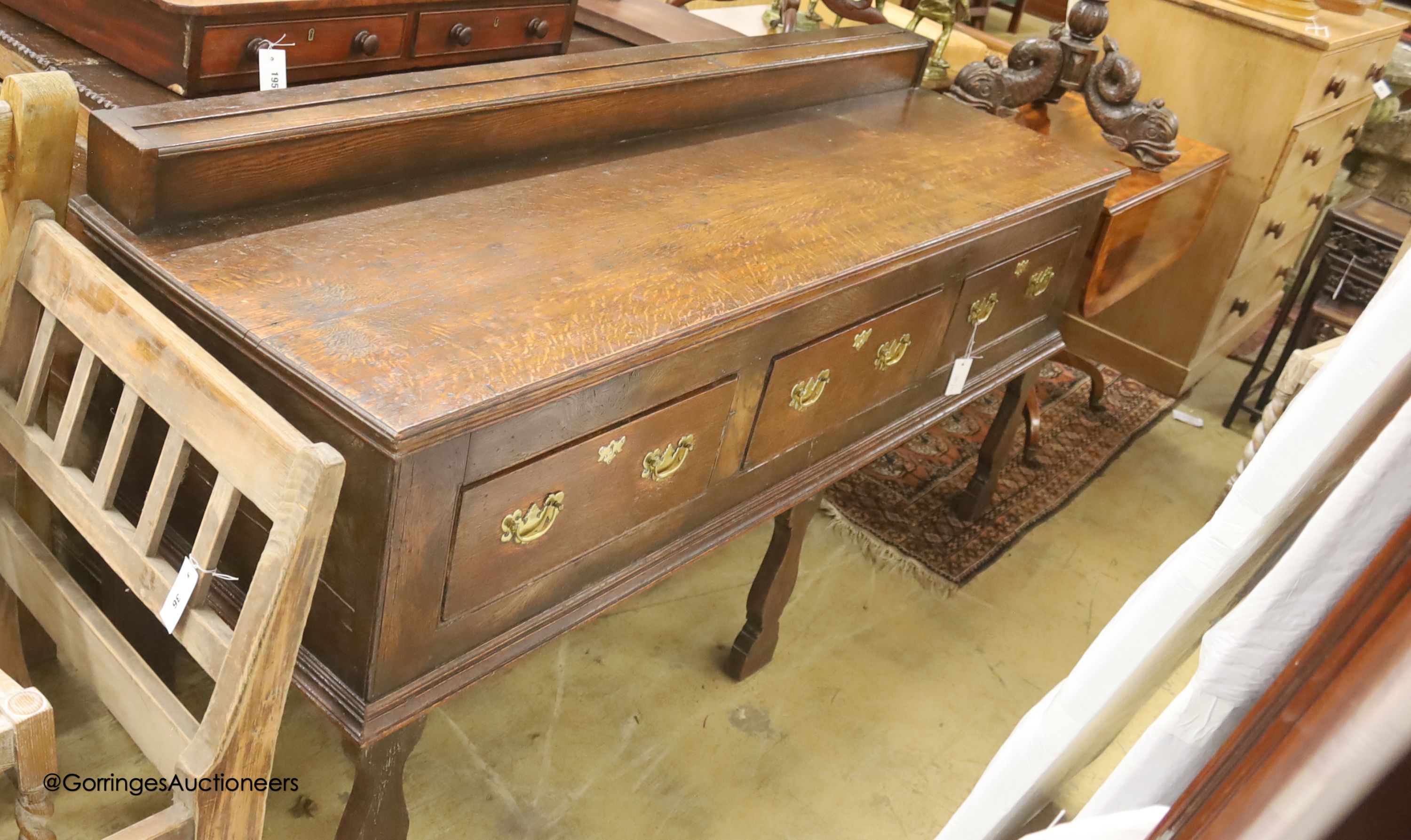 An 18th century oak low dresser, length 182cm, depth 58cm, height 90cm